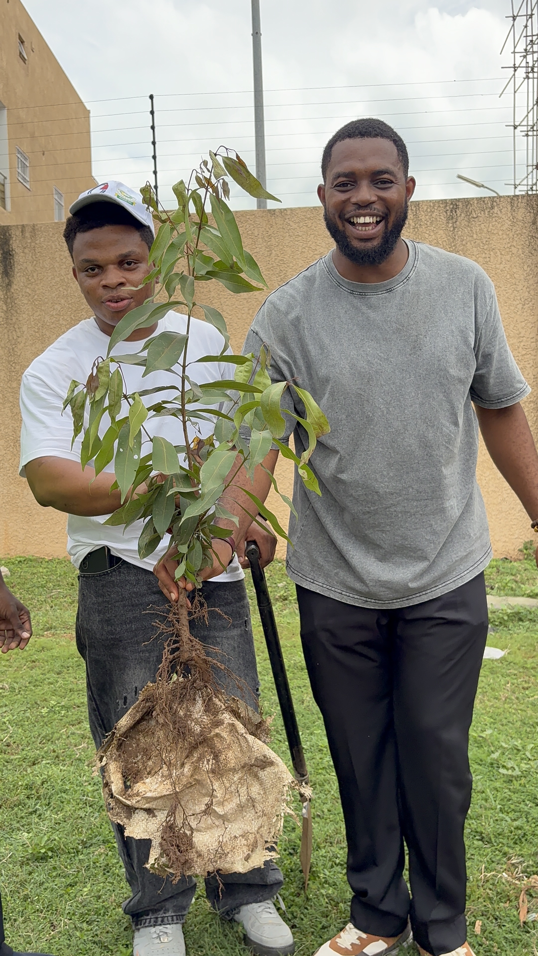 TheArkitecktsHub volunteer caring for a tree during the planting event